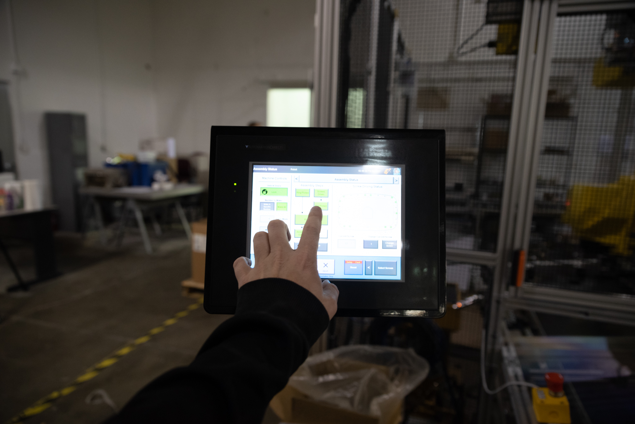 Person touching HMI Screen